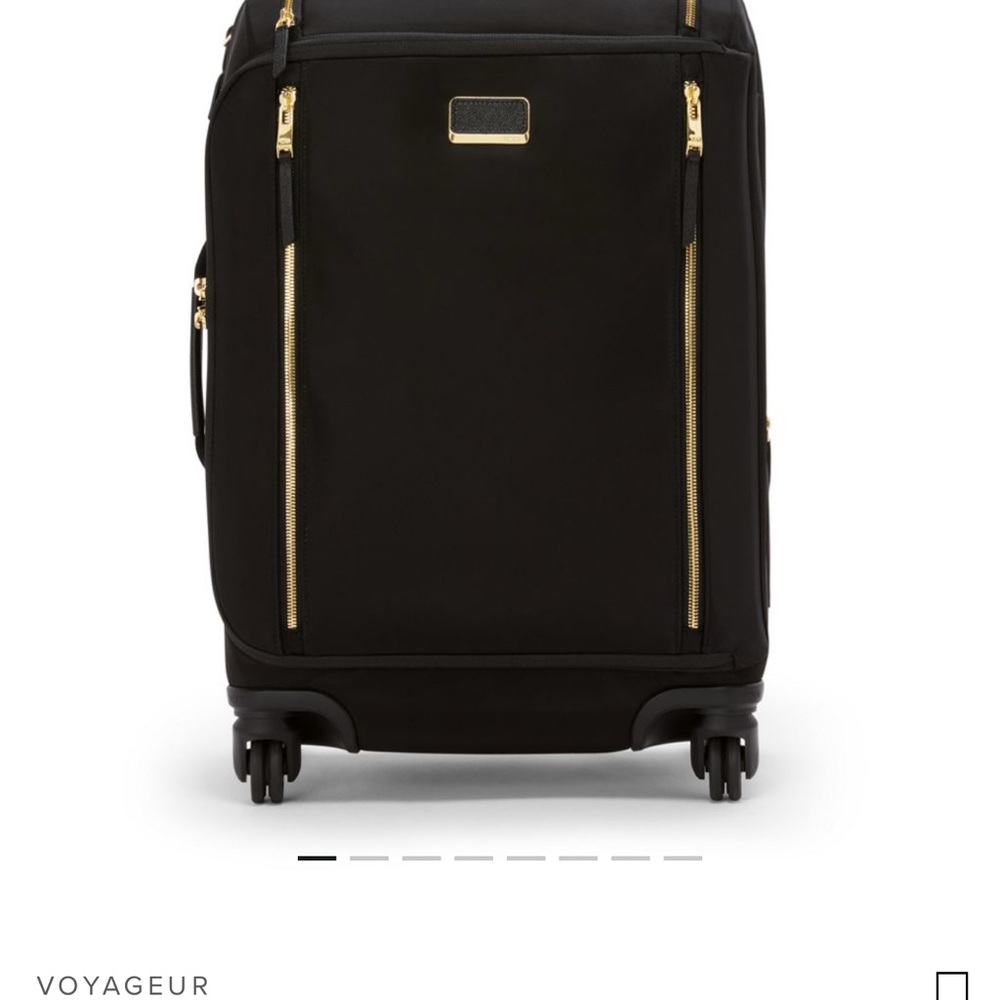 Tumi Black and Gold Rolling Luggage